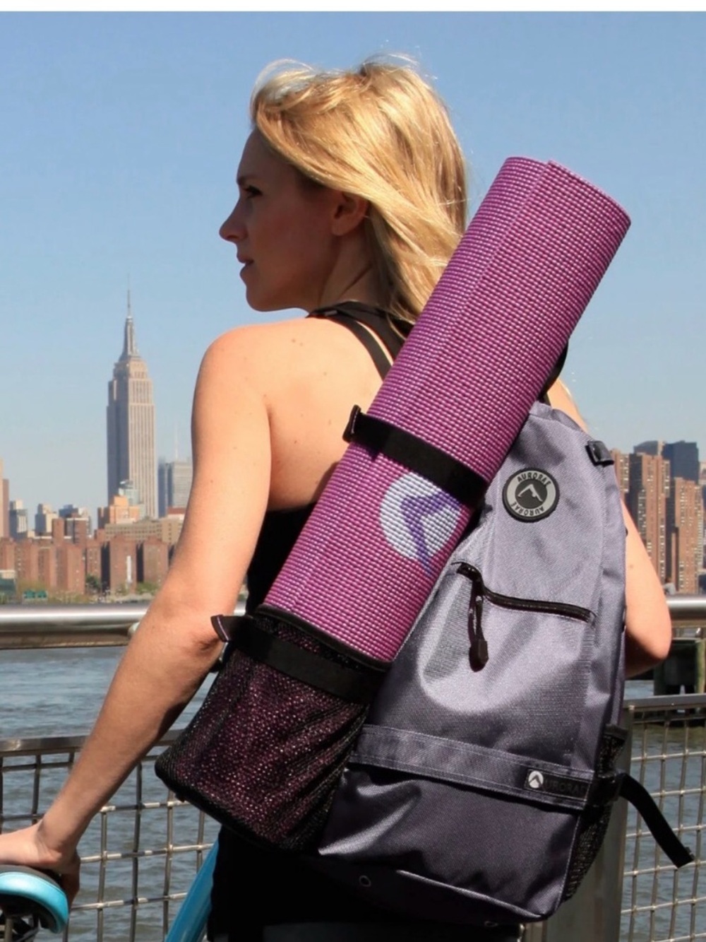 Aurorae Yoga/Gym Crossbody Backpack Gray with black trim.